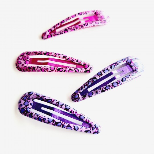 Hårspännen med glitter och leopardmönster